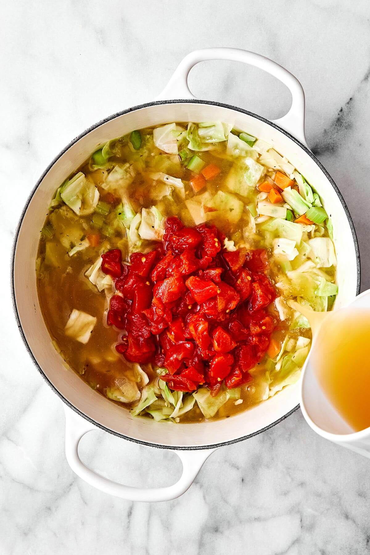 Making cabbage soup in a pot.