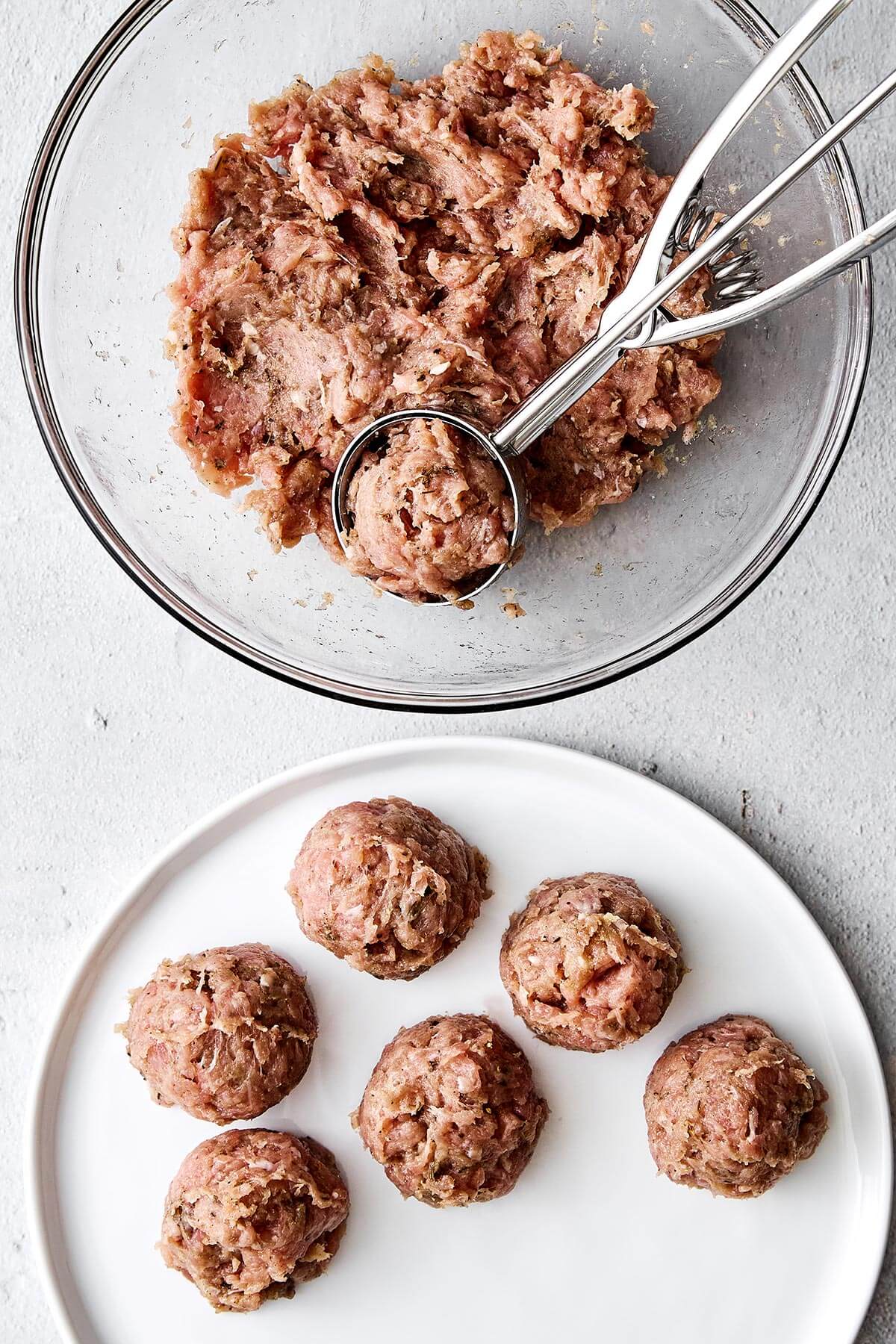 Forming chicken breakfast sausage balls.