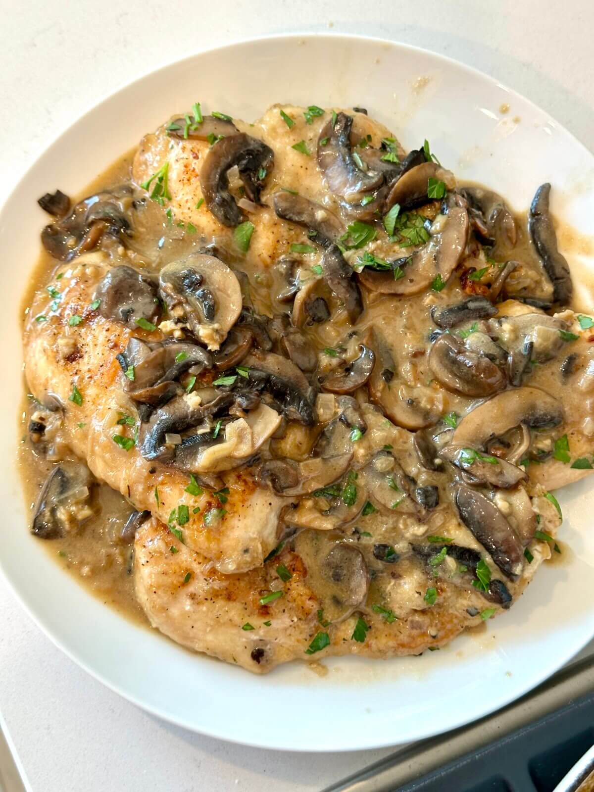 A plate of chicken marsala.