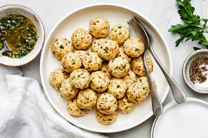 A white plate of chicken meatballs