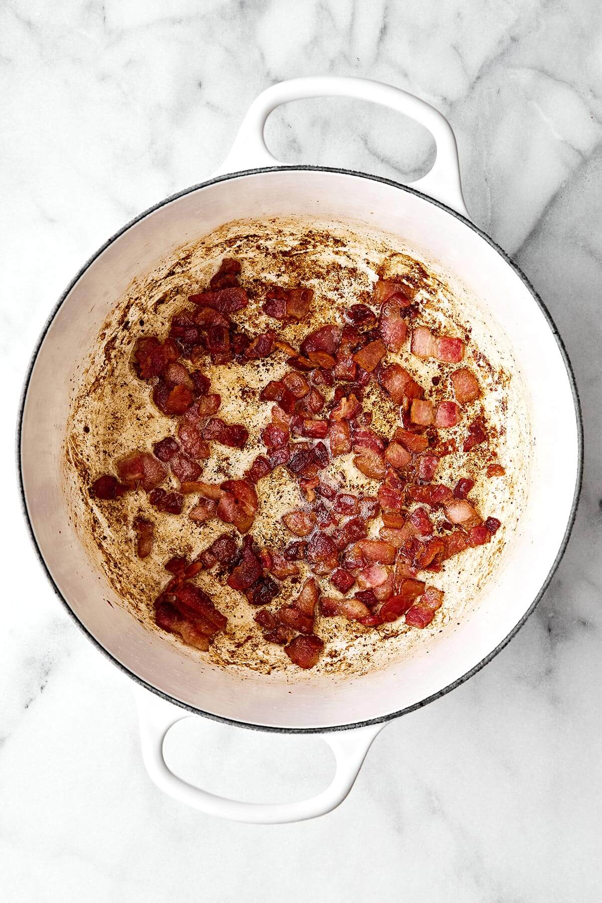 Cooked bacon in a pot.