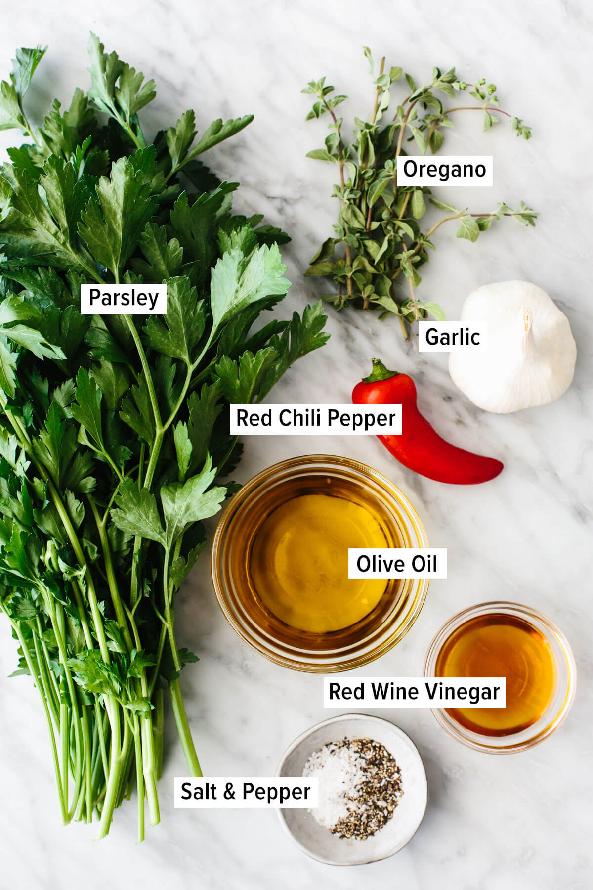 Ingredients for chimichurri sauce on a table