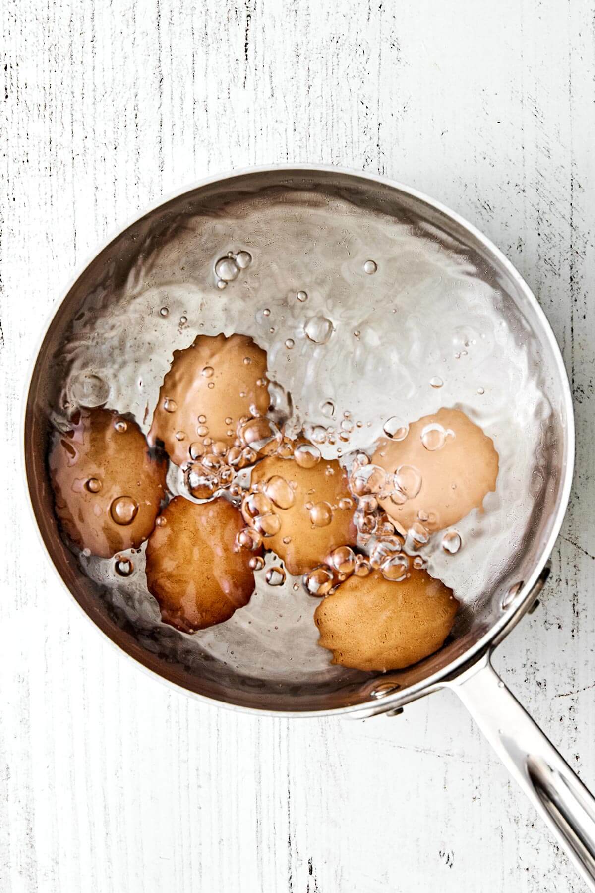 Boiled eggs in a pot.