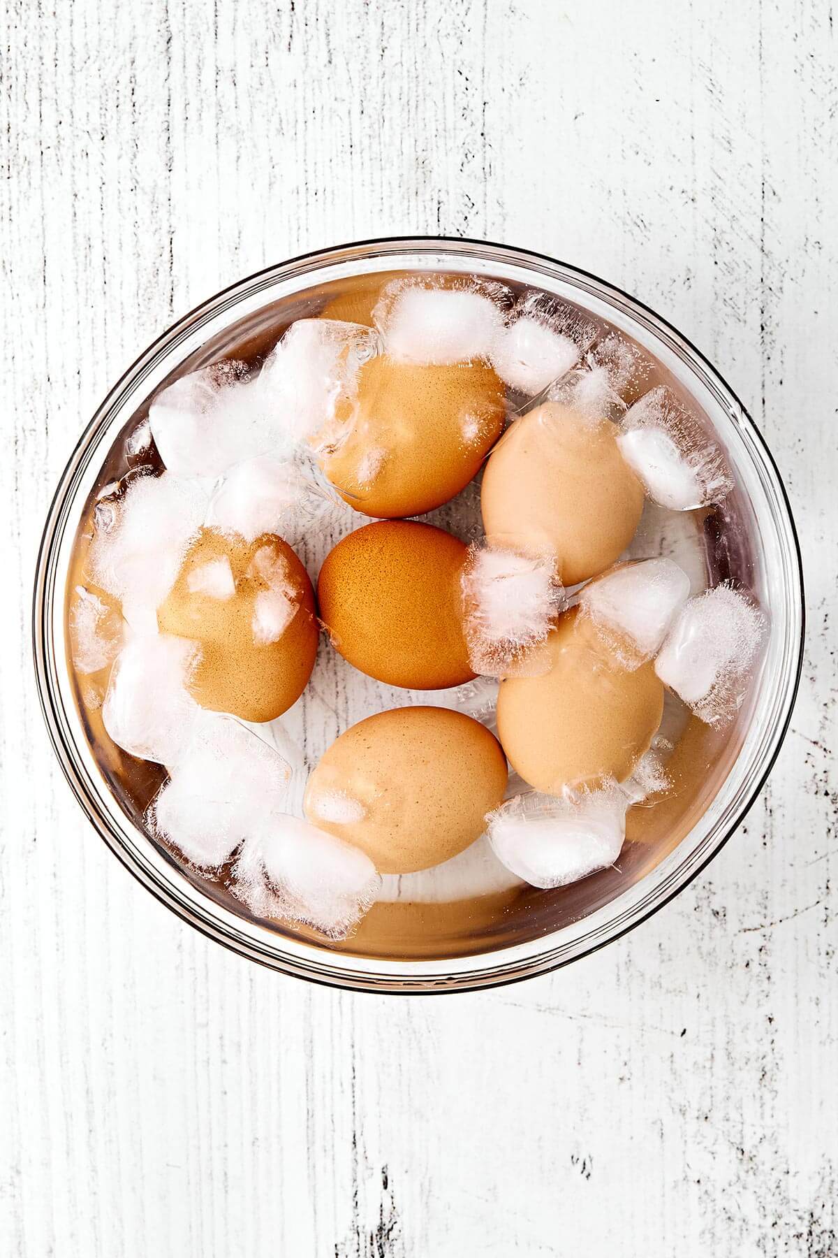 Chilled eggs in a bowl of ice.