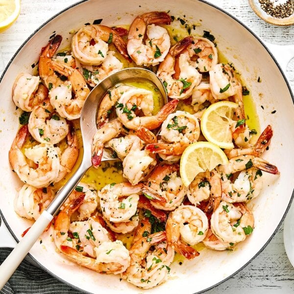 A white pan of garlic butter shrimp.