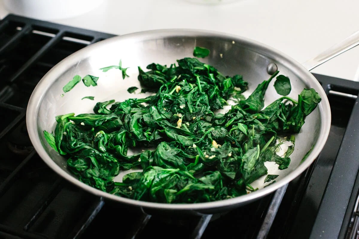 Sauteed spinach in a pan.