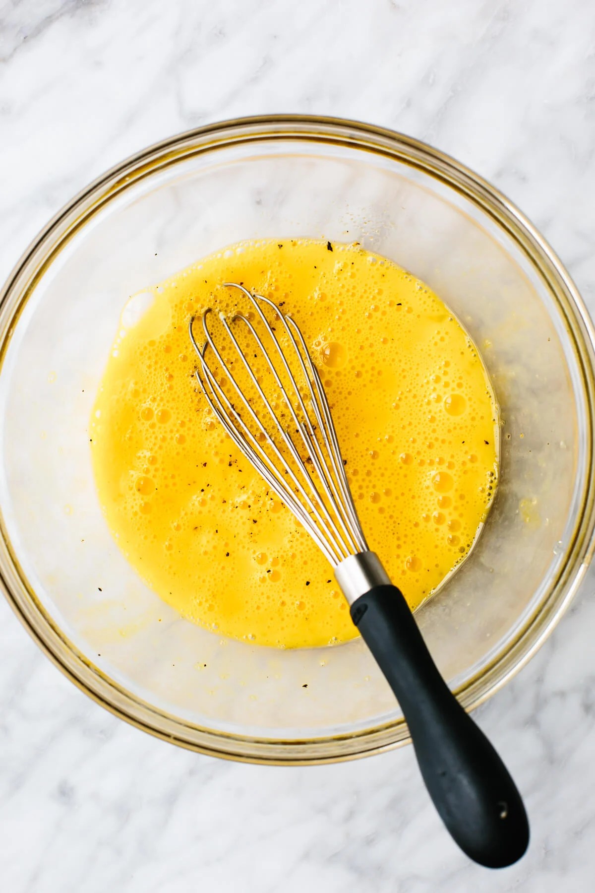 Mixing egg mixture for Greek scrambled eggs