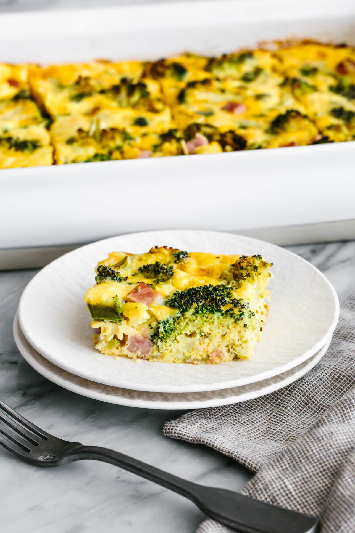 A sliced of ham and broccoli breakfast casserole