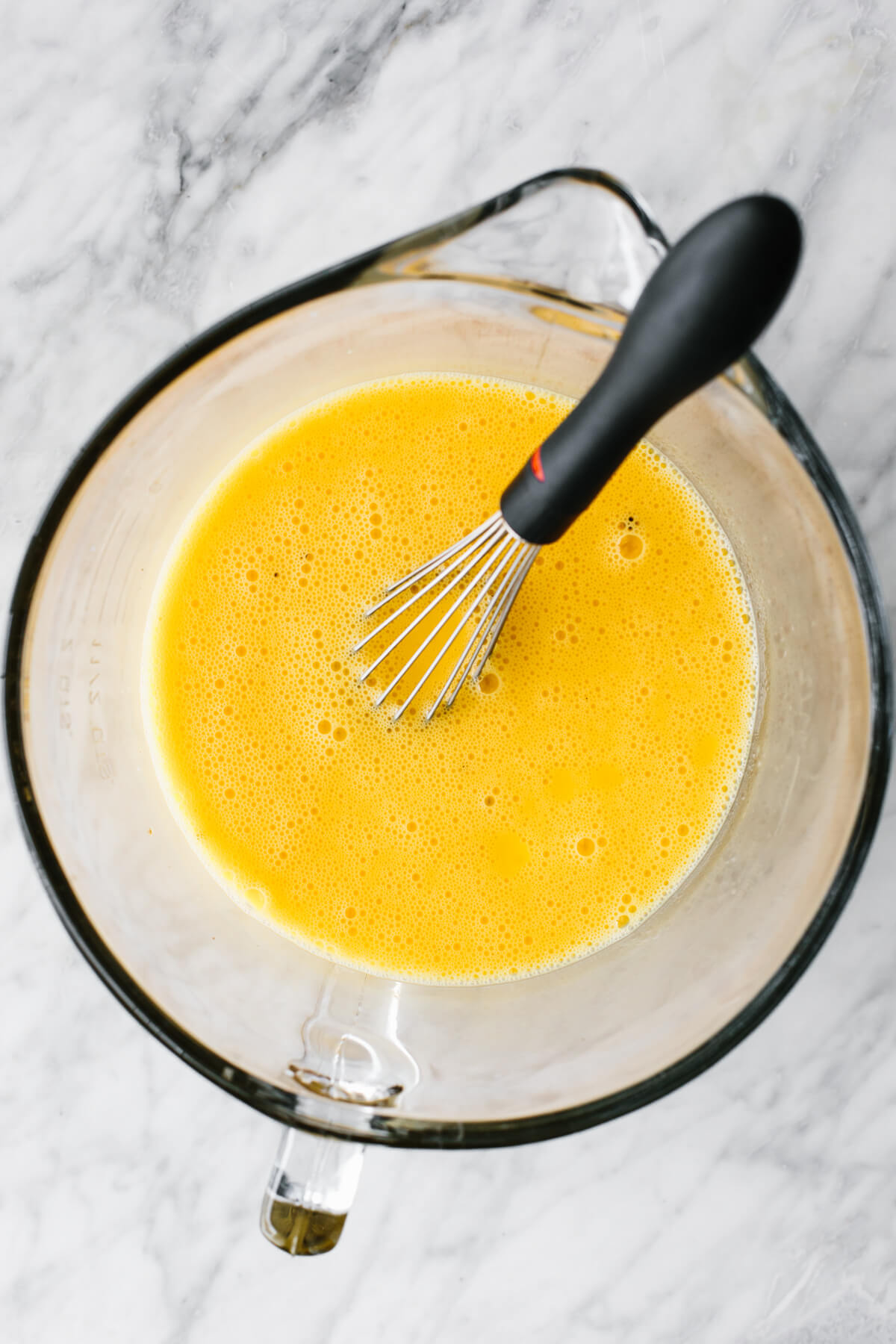Whisking eggs for ham and broccoli casserole