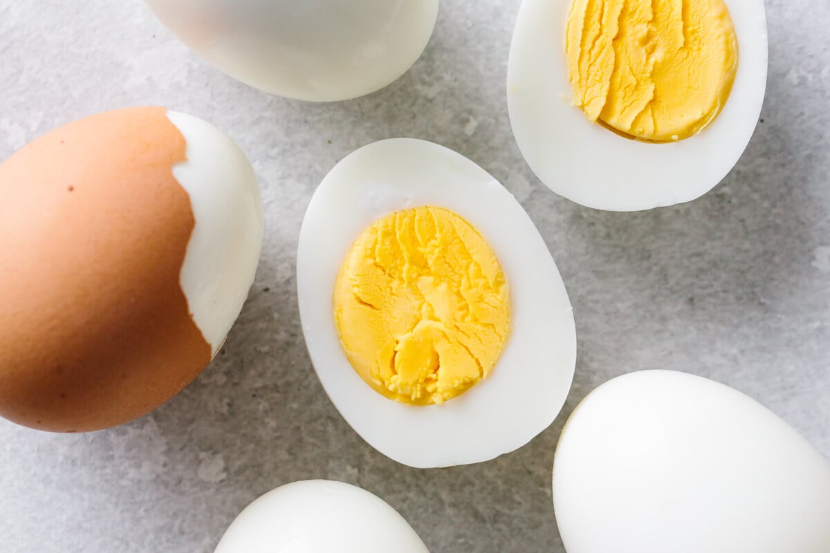 Learn how to make hard boiled eggs so that they're perfect and easy to peel! Never have divots or dents in your eggs again. Hard boiled eggs on the counter.