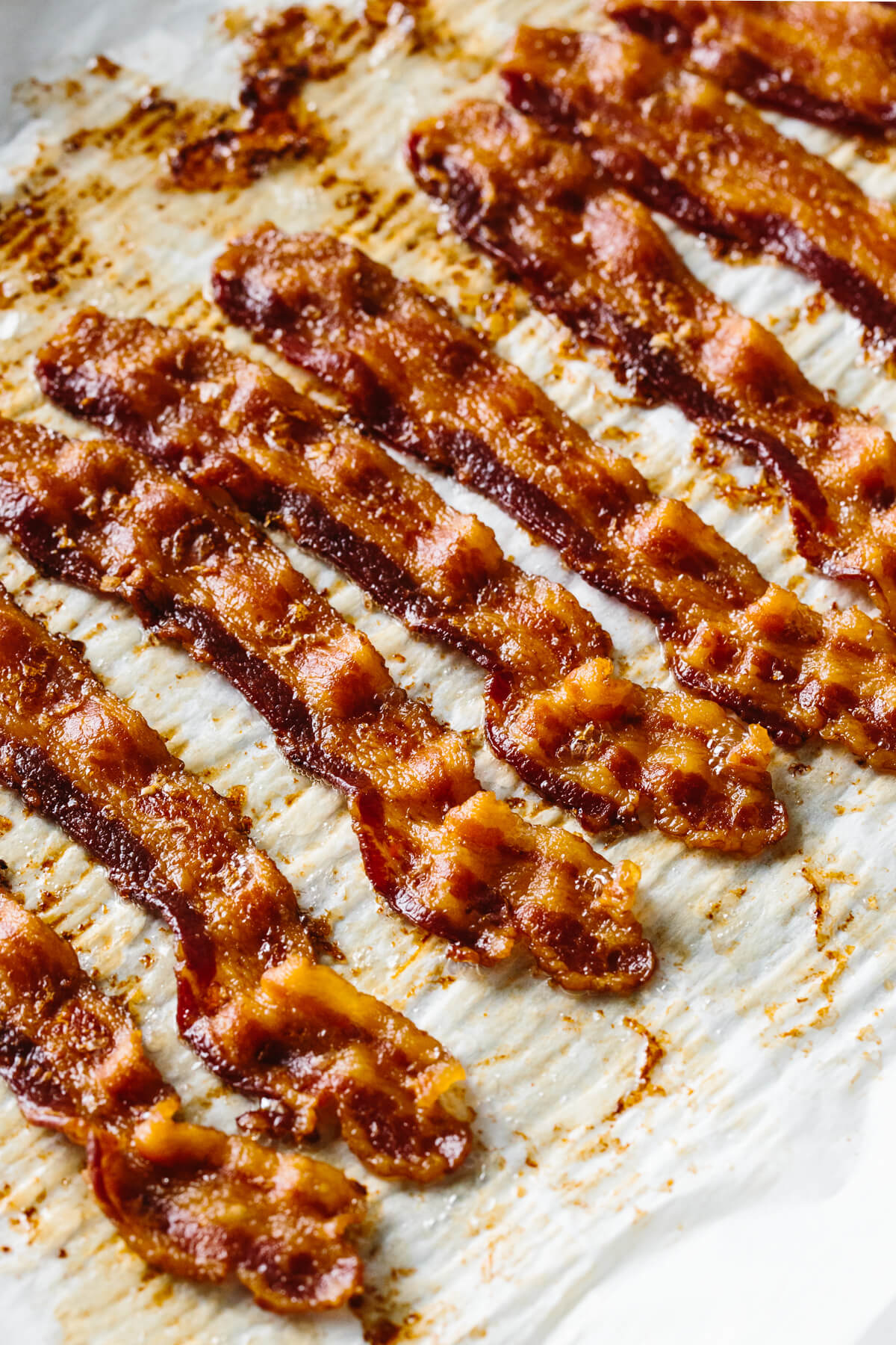 Crispy oven baked bacon on a sheet tray.