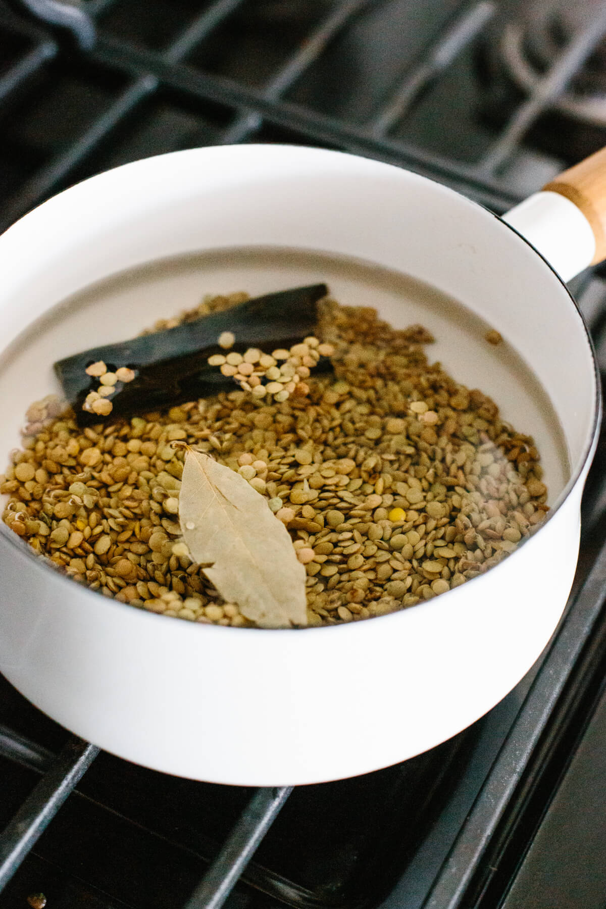 Cooking lentils in a pot on the stove.
