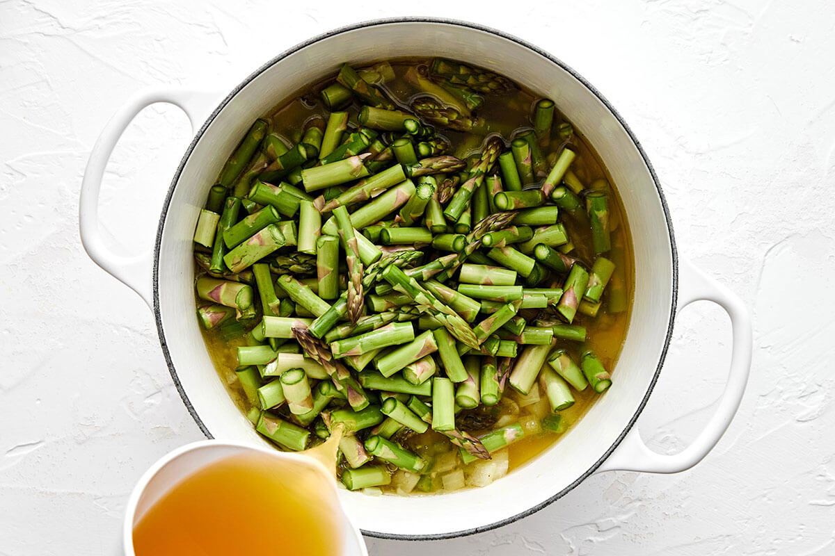 Cooking asparagus soup in a pot.