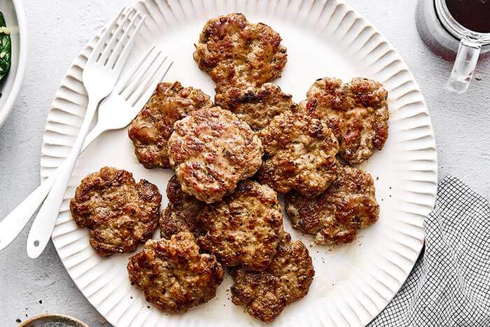 Chicken breakfast sausages on a plate.