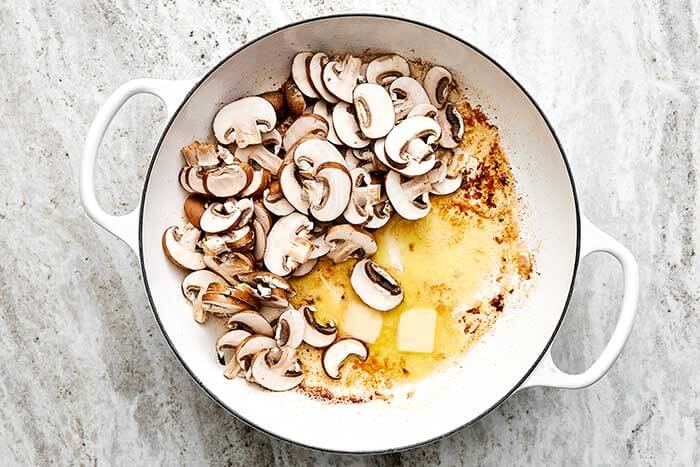 Cooking mushrooms in a pan.
