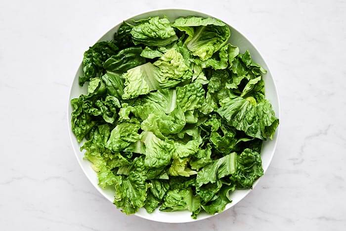 A bowl of lettuce.