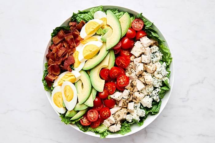 Making a Cobb salad.