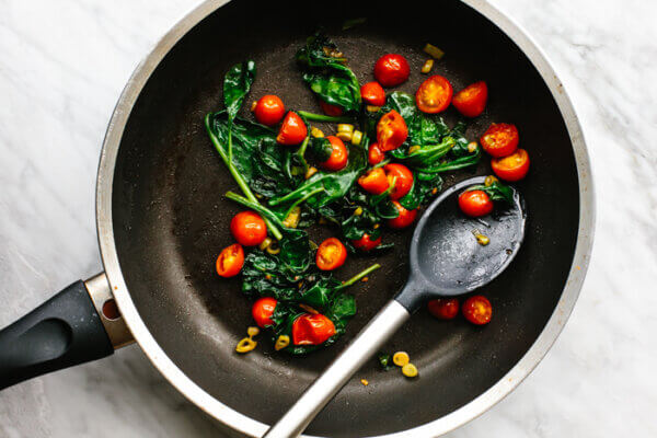 Veggies cooked in a pan for scrambled eggs