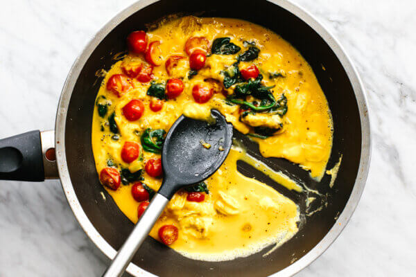 Mixing scrambled eggs in pan