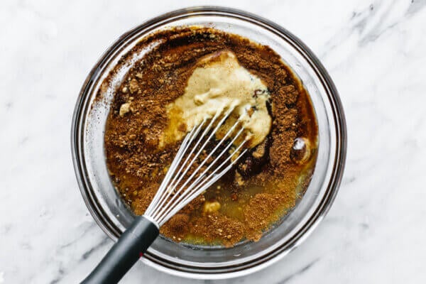 Mixing honey glaze in a bowl for honey baked ham