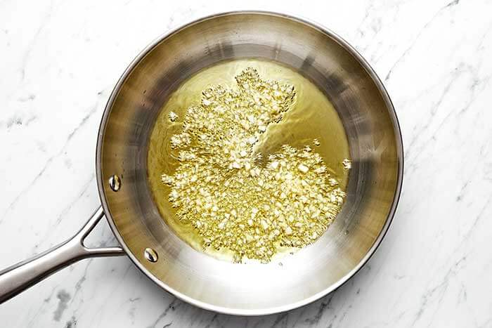 Cooking garlic in a pan.