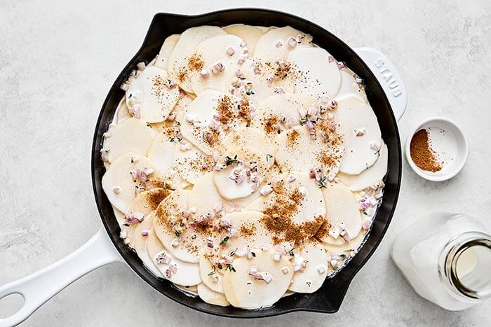 Finish layered scalloped potato.