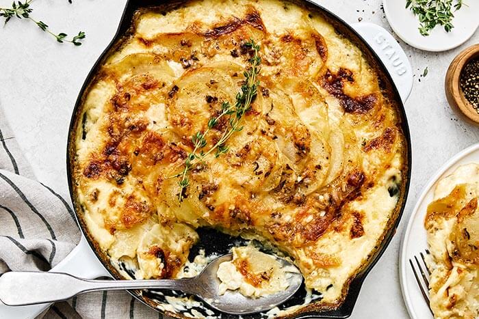 A pan with baked scalloped potatoes.