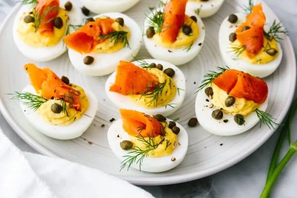 Smoked salmon deviled eggs with capers and dill.