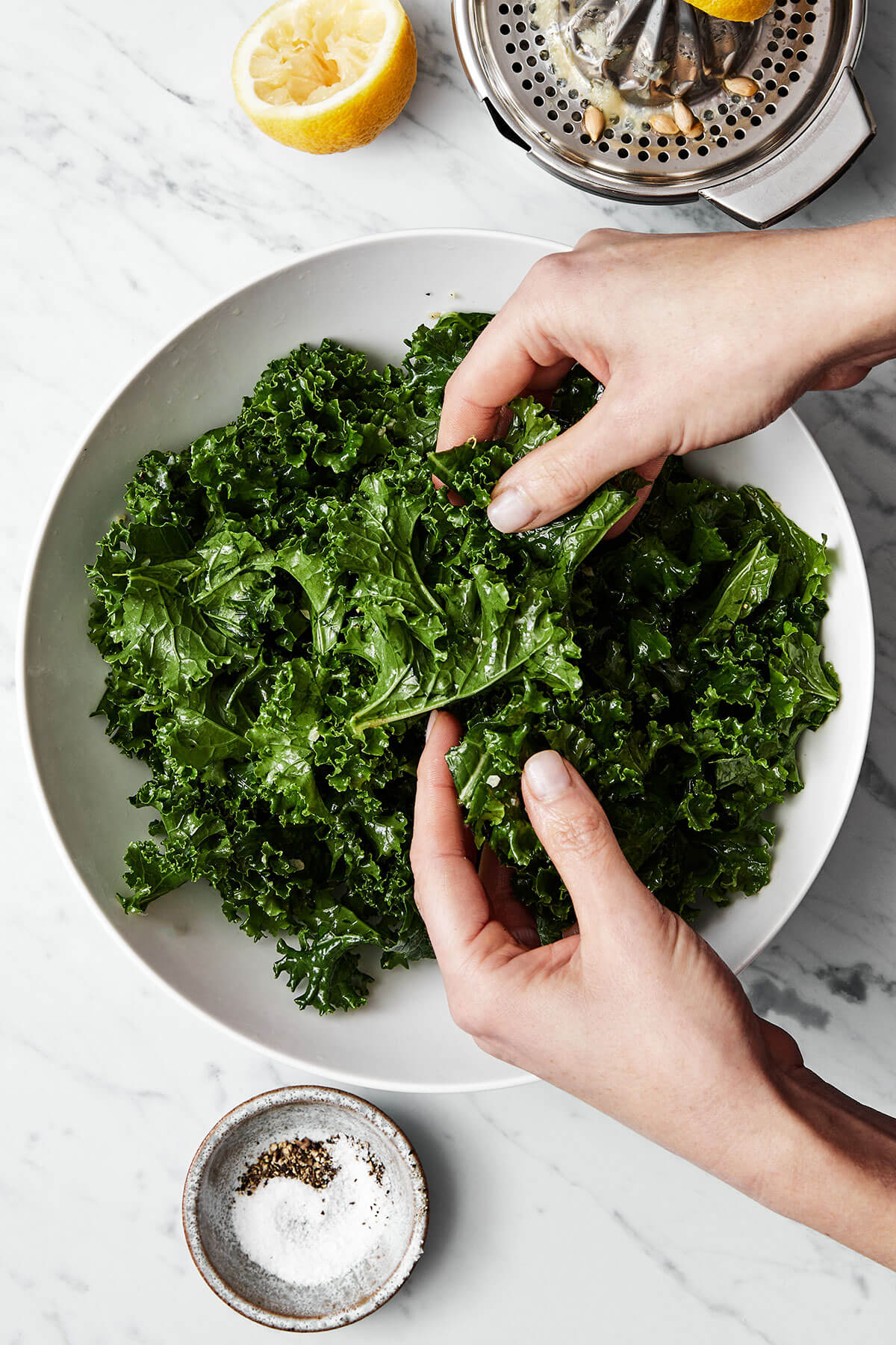 Massaging kale salad.