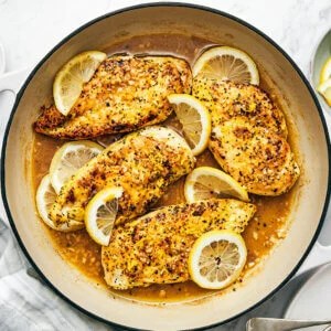 A pan with lemon pepper chicken.