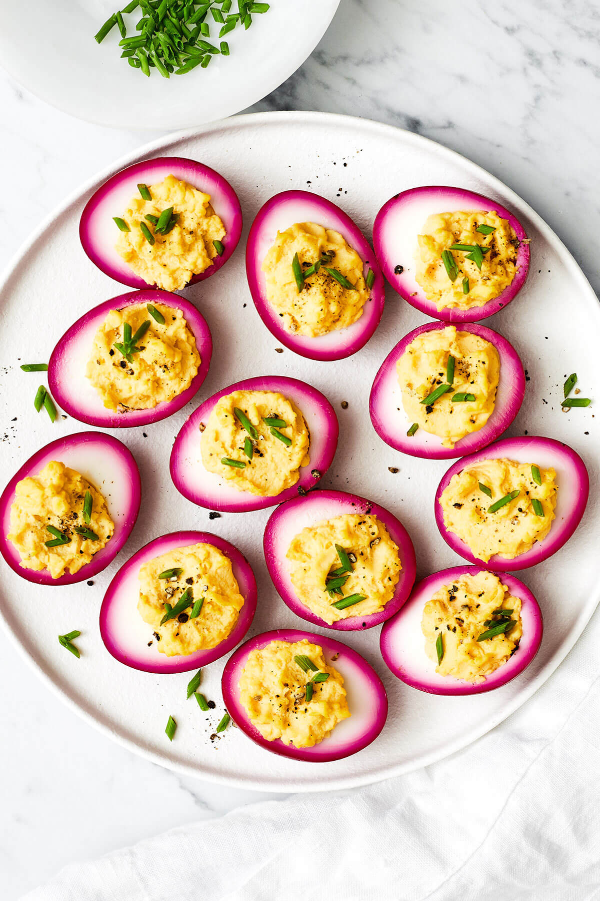 A platter of beet pickled deviled eggs