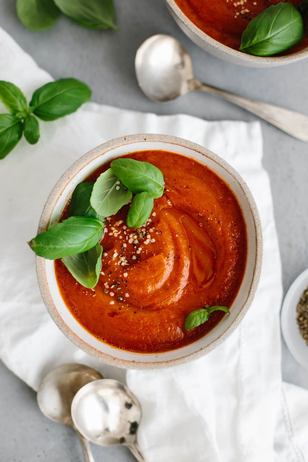 This roasted red pepper soup is a blend of red peppers, tomatoes, onion and garlic. It's a flavorful and healthy soup recipe!