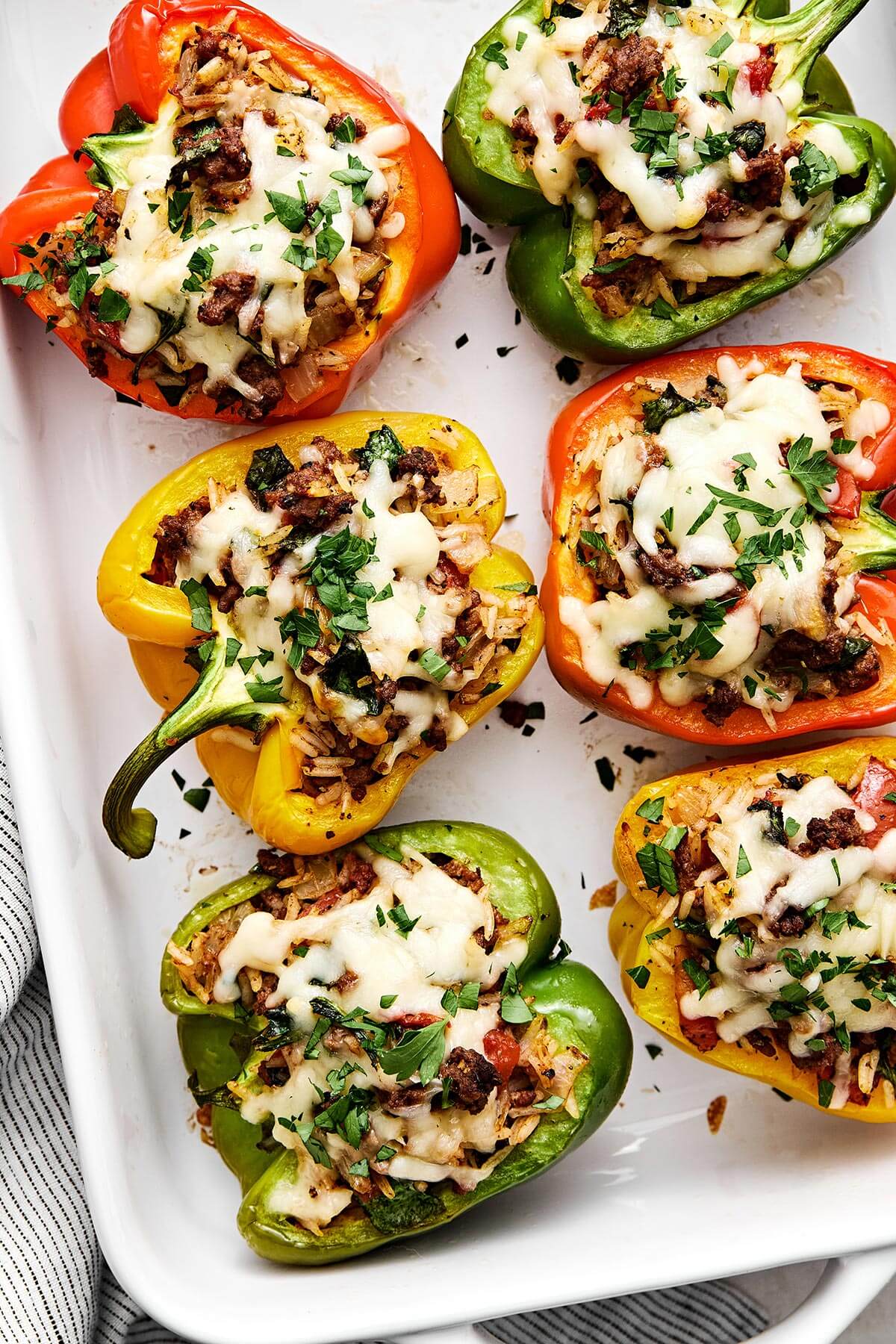 A baking dish filled with beef stuffed peppers.