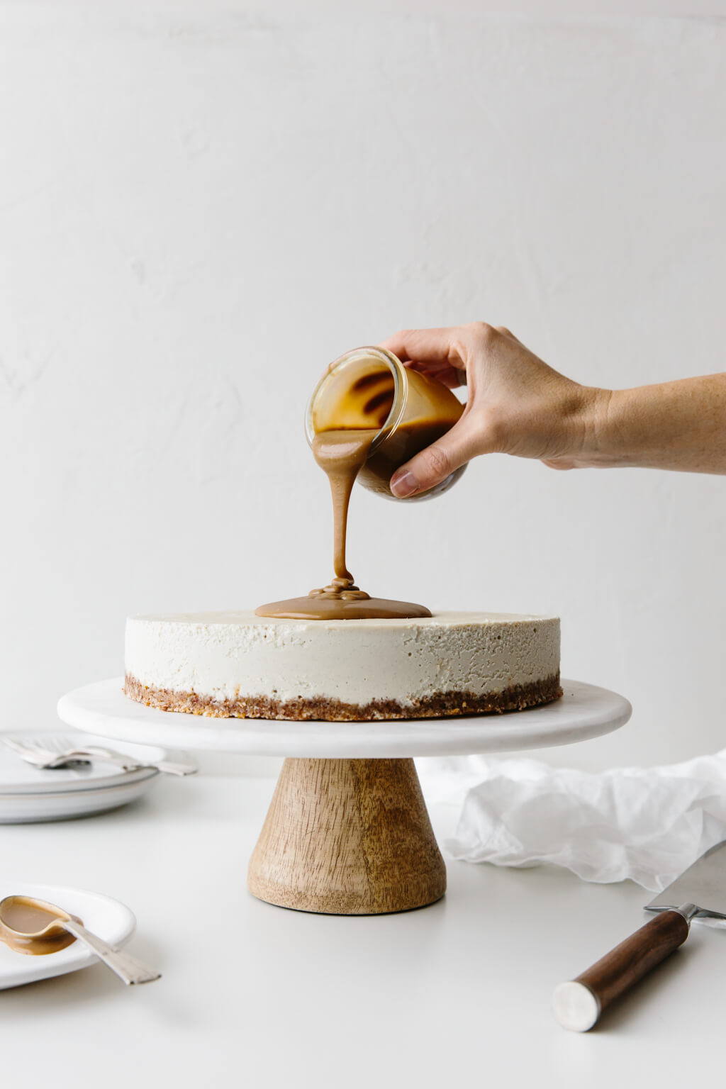 This gluten-free Vegan Caramel Cheesecake recipe is drizzled with the most amazing salted caramel sauce. The vegan cheesecake is simply made from cashews that have soaked overnight and it's super creamy and decadent.