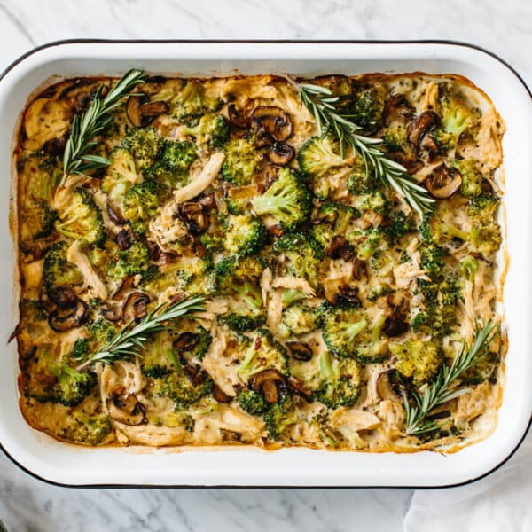 Whole30 casserole recipe with shredded chicken, sautéed mushrooms and broccoli, then topped with my Vegan Alfredo Sauce for an easy and healthy weeknight dinner. It's also a dairy-free and paleo casserole recipe.